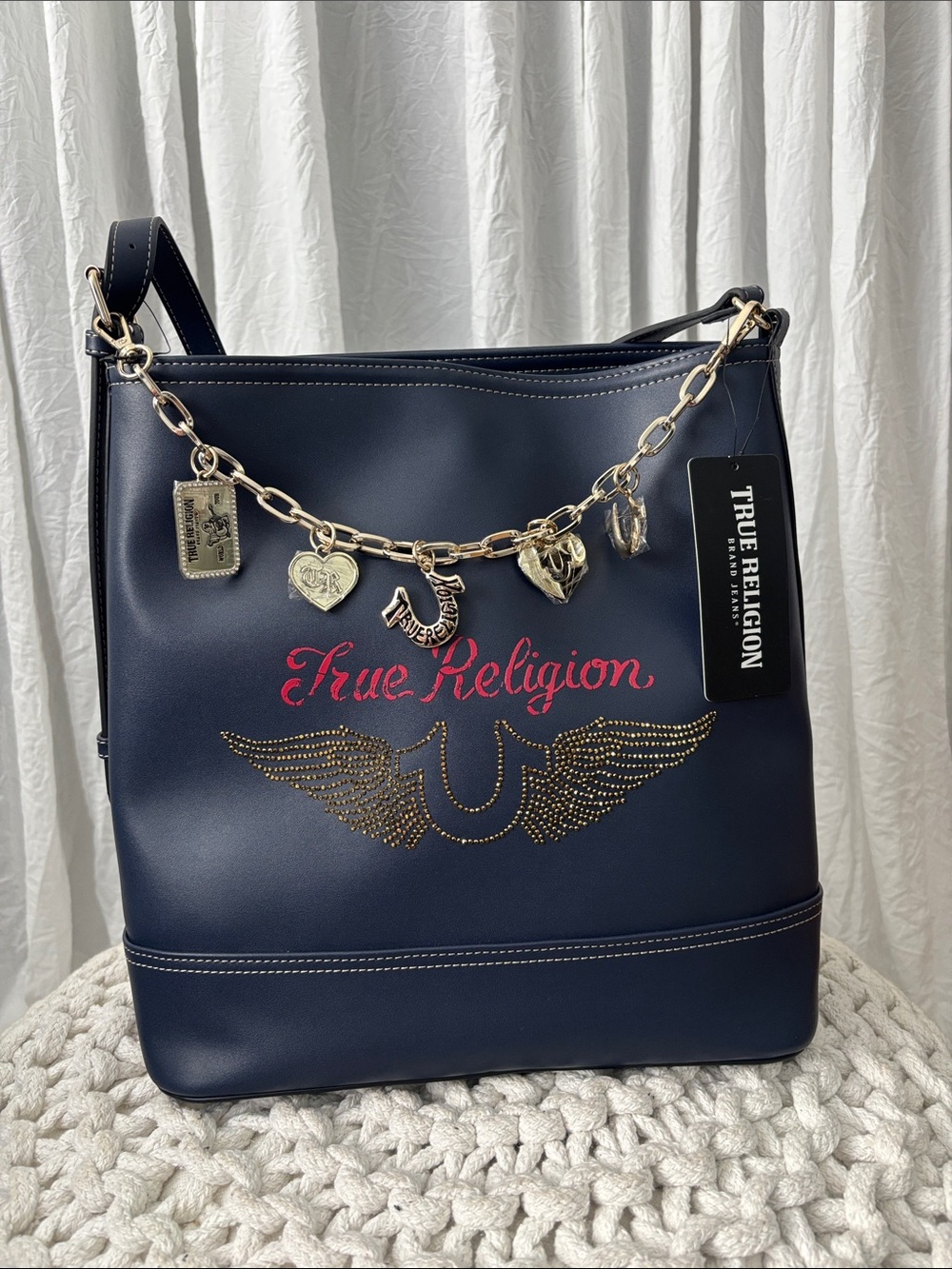 True Religion Navy Shoulder Bag with Gold Charm Chain and Pink Logo